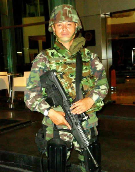 THAI SOLDIERS GUARD BANGKOK'S STREETS ARMED THAI SOLDIER ON LOWER SUKHUMVIT IN BANGKOK